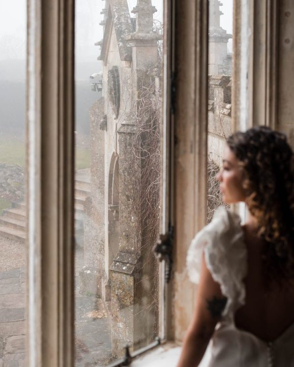 bride at window of country house